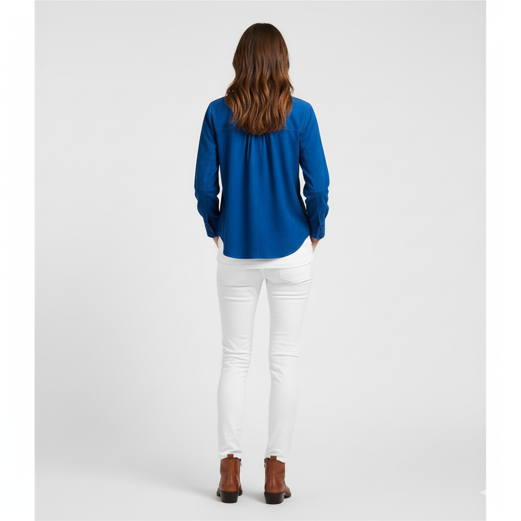 Model wearing a blue suede shirt with white jeans and brown boots