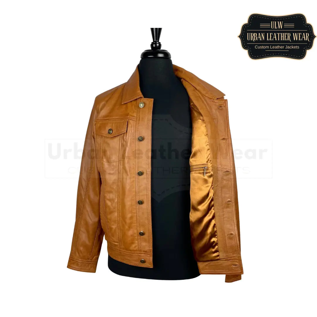 Shop This tan leather trucker jacket will elevate any outfit with its denim style.