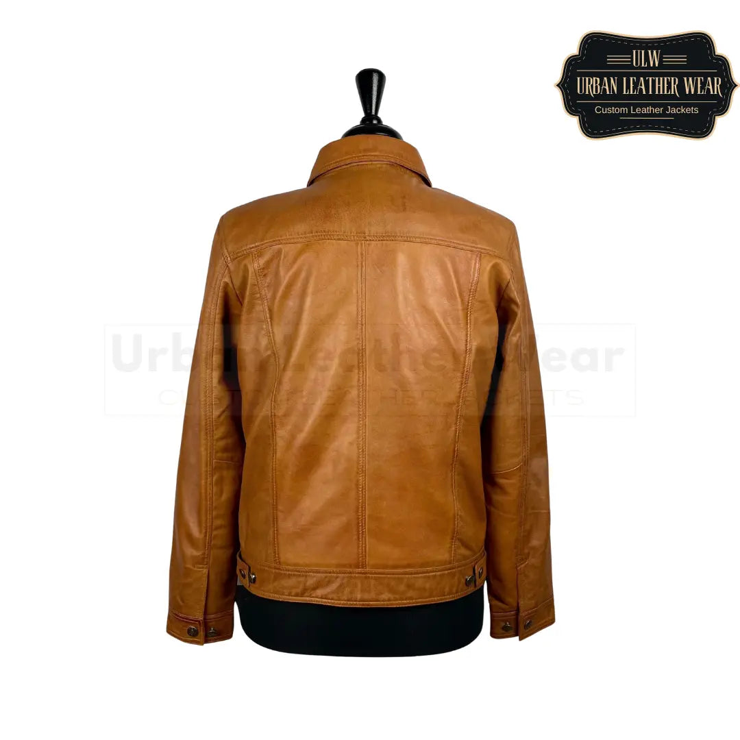 Shop This tan leather trucker jacket will elevate any outfit with its denim style.