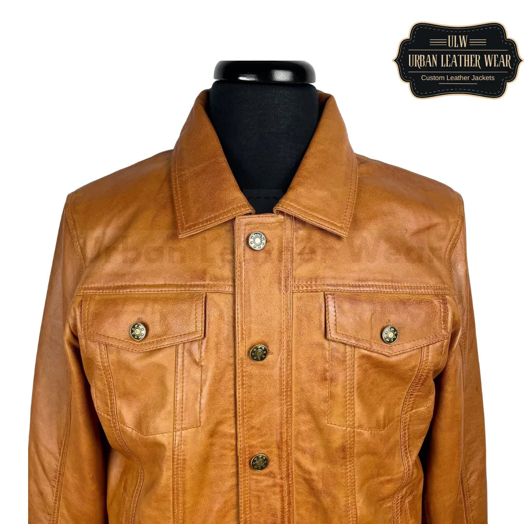 Shop This tan leather trucker jacket will elevate any outfit with its denim style.